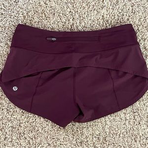 Lululemon Speed Up Shorts wmn’s size 4 burgundy low rise, 2.5 inseam. Never worn
